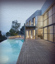 View of modern house next to a pool with wood decking