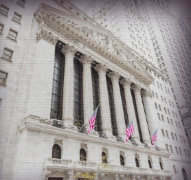 Front of building with three United States flags hanging up